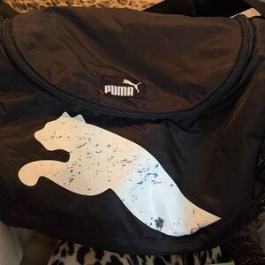 Puma black duffle bag outside vented pocket adjustable shoulder strap white puma